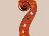 an old violin with a wooden back and a long neck