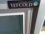 a close up view of a window with a tefcold sticker on it