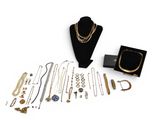 an assortment of gold and silver jewelry including a necklace, bracelet, and ring