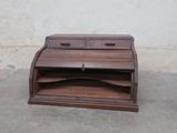 a small wooden desk with a drawer on top of it