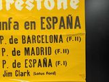 a yellow poster with a picture of a racing car on it
