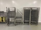 many trays of food on the shelves in the kitchen