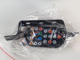 a remote control in a plastic bag next to a toaster