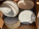 a box full of plates and bowls in it