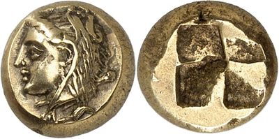 a silver coin with an image of a woman ' s head on it