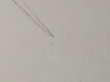 someone is flying a kite in the sky on a cloudy day