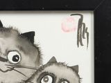a picture of two cats that are sitting next to each other