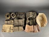 an assortment of military items laid out on a gray surface
