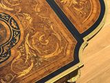 a small table with a decorative design on it