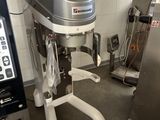 a machine that is sitting in a kitchen next to a machine