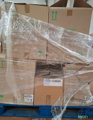 a pallet with a bunch of boxes wrapped in plastic