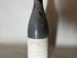 a bottle of wine that is sitting on a counter