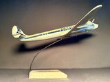 a model of an airplane on a stand on a table