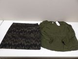 two pieces of clothing sitting on a white table