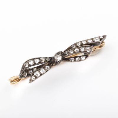 an antique diamond and gold broochle broochle