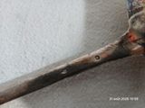 une cuillère sur laquelle est représentée une sorte de cuillère