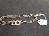 a close up of a chain with a tag attached to it