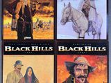 four black hills books are on display in a book case