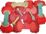 a lot of red and green dog toys on a white surface