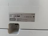 a close up of a white refrigerator with a label on it