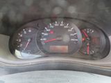 a close up of a car dashboard with a speedometer