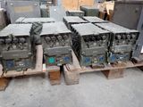 a lot of military equipment on a pallet in a warehouse