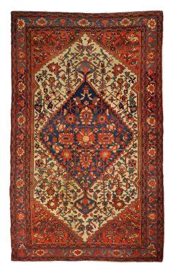 tapis persan ancien à motifs bleus et rouges