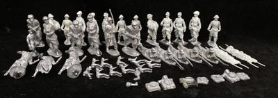 an old black and white photo of a group of figurines