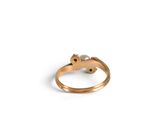 an image of a gold ring with a pearl and a diamond