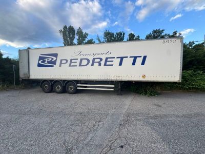 a semi truck that is parked in a parking lot