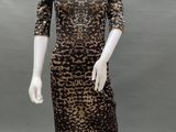 a mannequin wearing a leopard print dress and hat