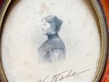 a picture of a woman that is in a picture frame