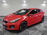 a red car parked in a garage with a checkered floor