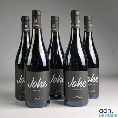 three bottles of wine sitting on top of a table next to each other