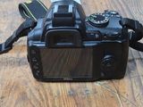a camera on a table with a strap around it