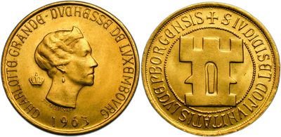 a close up of a gold coin with a cross on it