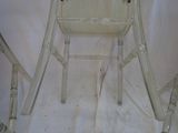 an image of a plastic chair with a broken seat