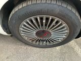 a close up of a tire on a car ' s rim