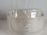 a roll of tape wrapped around a bowl on a table