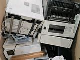 a cardboard box full of electronic equipment in a room