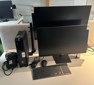 an image of a computer desk with a keyboard and monitor