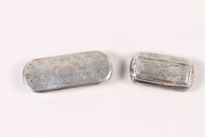 pair of silver plated pill cases with floral designs