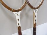 two tennis racquets that are sitting on a table