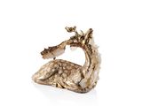 a gold sculpture of a dragon on a white surface