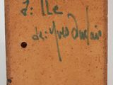 a small brown box with writing on it