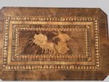 an image of a wooden box with a picture of a horse and rider on it