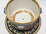 a cup and saucer sitting on a saucer on a table