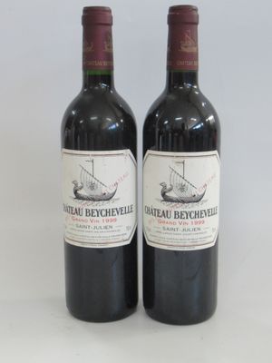 two bottles of red wine sitting next to each other on a table