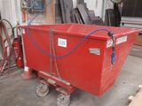 a red dumpster that is sitting in the garage