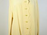yellow jacket on a mannequin dummy with a white background
